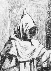 monnik bij kruisbeeld